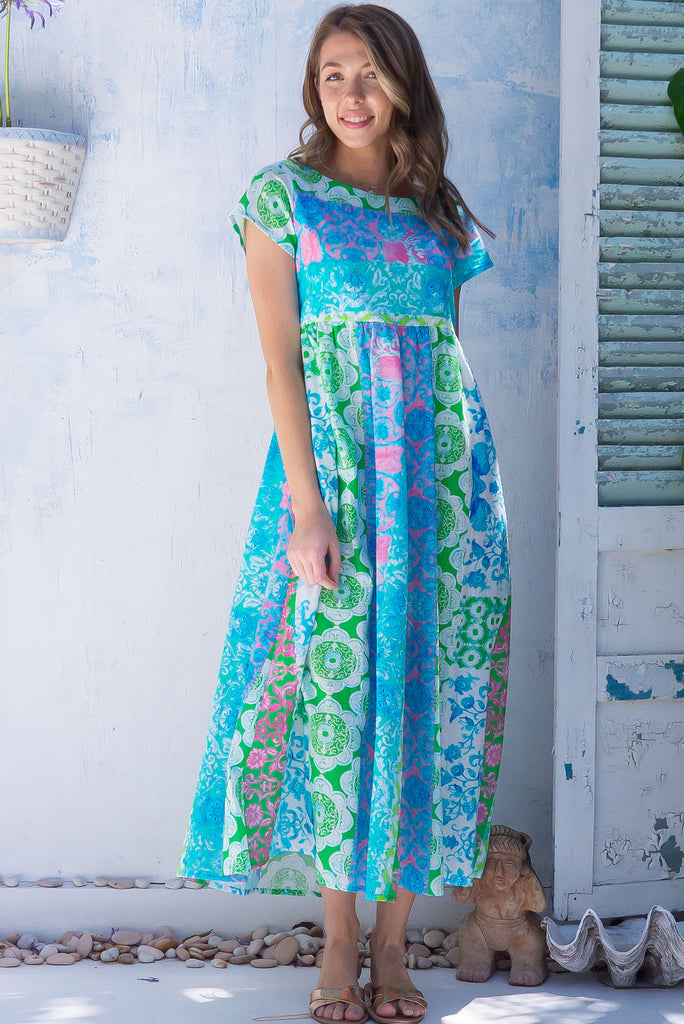 The Cocoloco Seashine Dress is a gorgeous green, blue and pink bohemian patch printed midi dress. The dress features short sleeves, pockets, and is made from woven 100% cotton. 