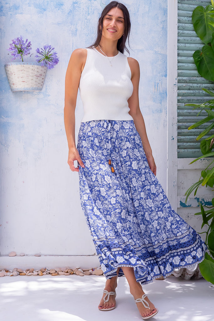 The Cosima Villa Blue Maxi Skirt is a beautiful blue maxi skirt with a White Island style print. The maxi skirt features an elastic waistband. Made from 100% rayon.