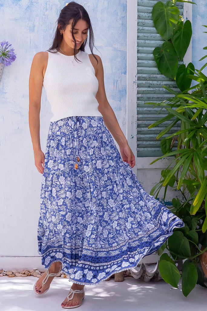 The Cosima Villa Blue Maxi Skirt is a beautiful blue maxi skirt with a White Island style print. The maxi skirt features an elastic waistband. Made from 100% rayon.