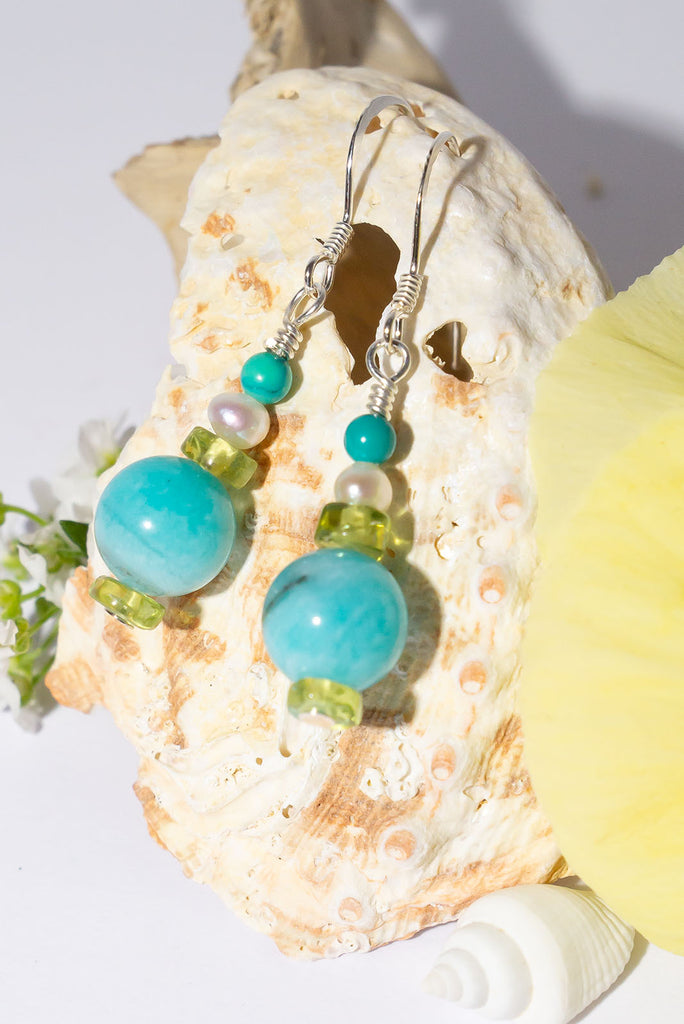 Featuring shades of a tropical lagoon these delicate gemstone droplet earrings are the perfect accessory for Spring & Summer.