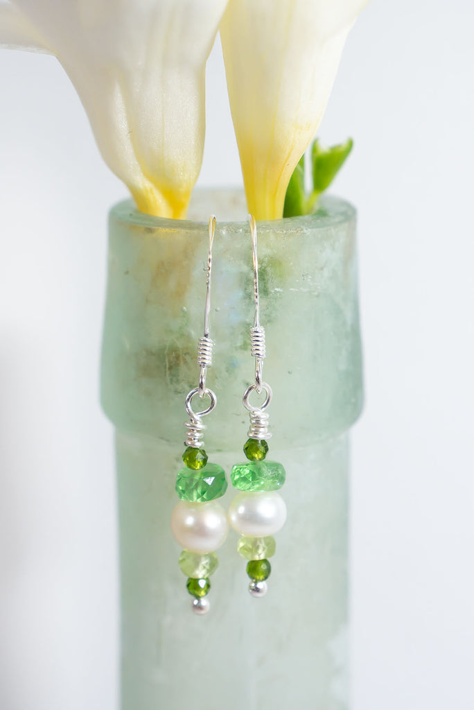 3 shades of green are complimented beautifully by a soft white pearl. The perfect earrings for all of the green lovers out there.