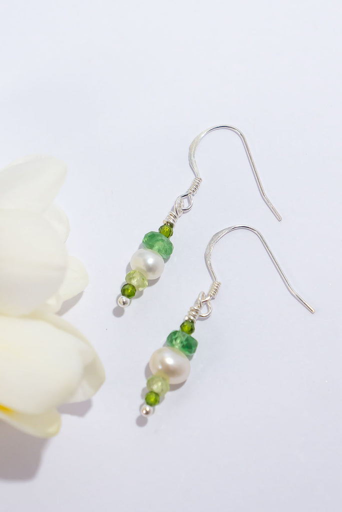 3 shades of green are complimented beautifully by a soft white pearl. The perfect earrings for all of the green lovers out there.