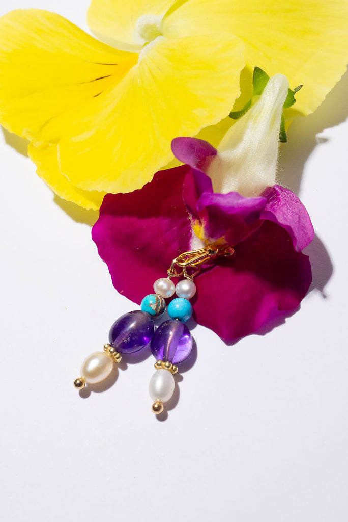 Our Inez gemstone earrings bring you a pretty tumble of colourful shimmering gemstones.