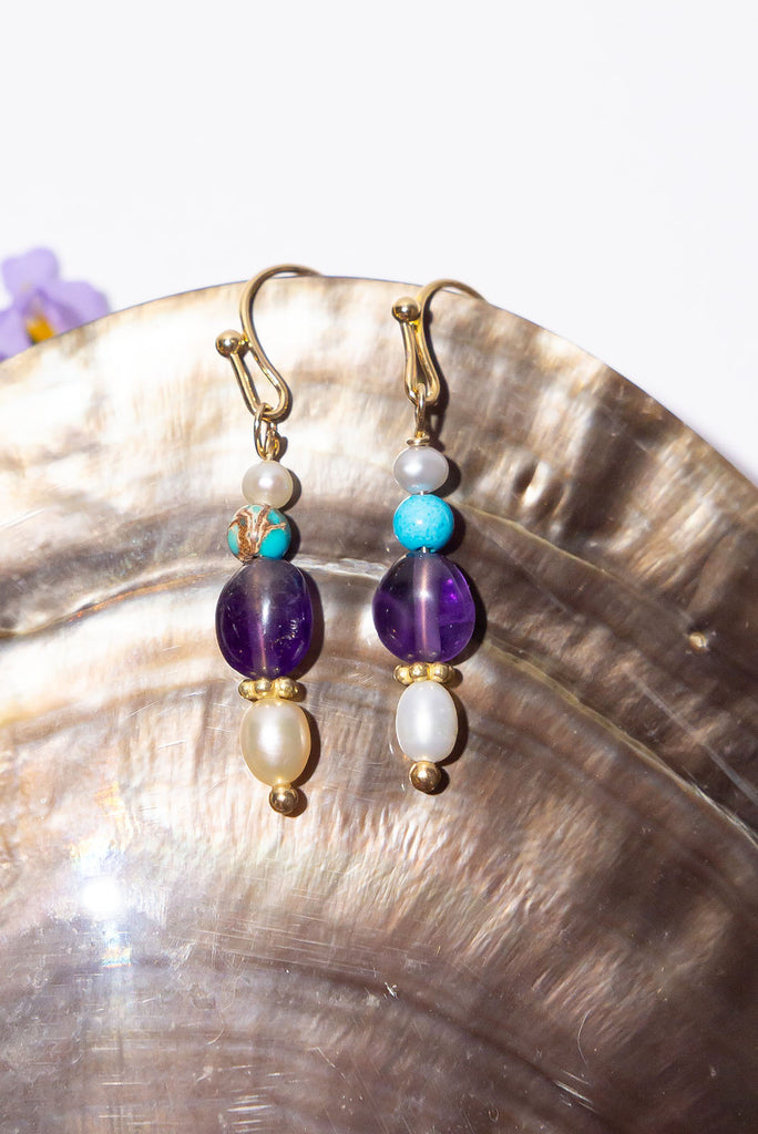 Our Inez gemstone earrings bring you a pretty tumble of colourful shimmering gemstones.