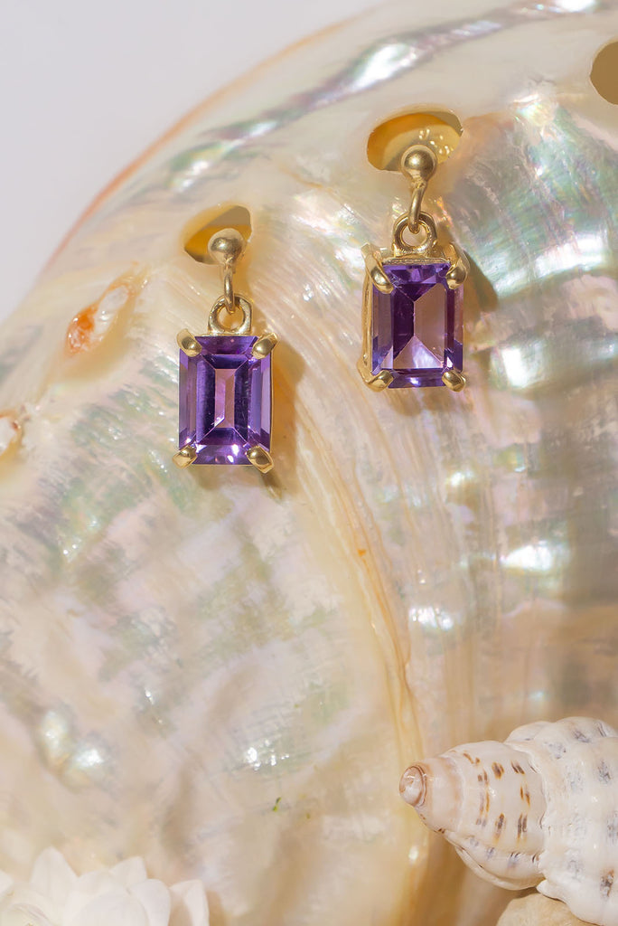 These sparkling clear Amethyst earrings are both romantic and chic. Pretty earrings with an emerald cut Amethyst gemstones set in 9ct gold vermeil. Made exclusively for Mombasa Rose Boutique.