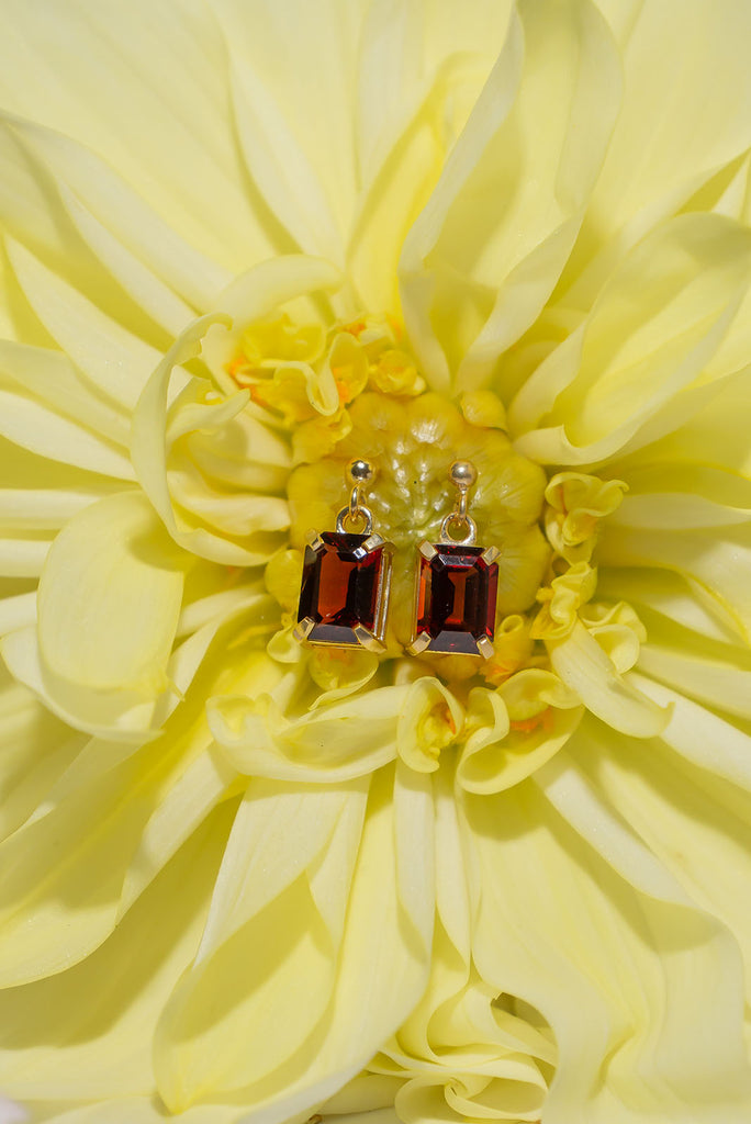 These gorgeous deep red sparkling Garnet earrings are both romantic and chic.&nbsp; Sophisticated earrings with an emerald cut Garnet gemstones set in 9ct gold vermeil. Made exclusively for Mombasa Rose Boutique.