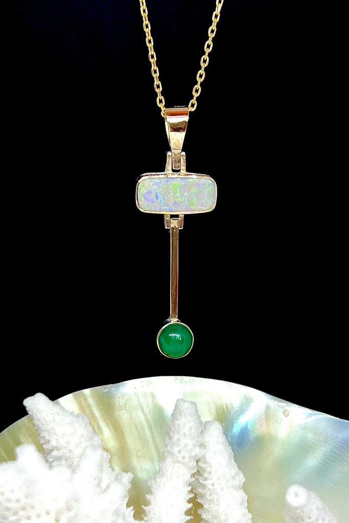 This really cool Vintage pendant features a stunning solid Australian Opal with hanging bar which has a deep green Queensland Chrysoprase cabochon detail.