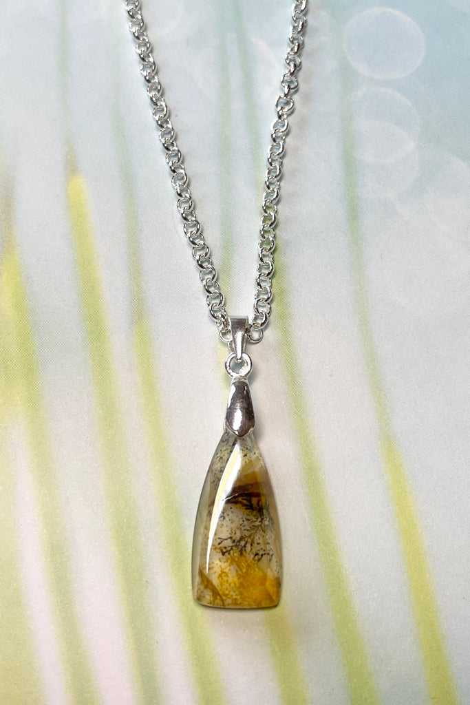 This mysterious lodolite garden quartz crystal necklace will lift your spirits wherever you go!
