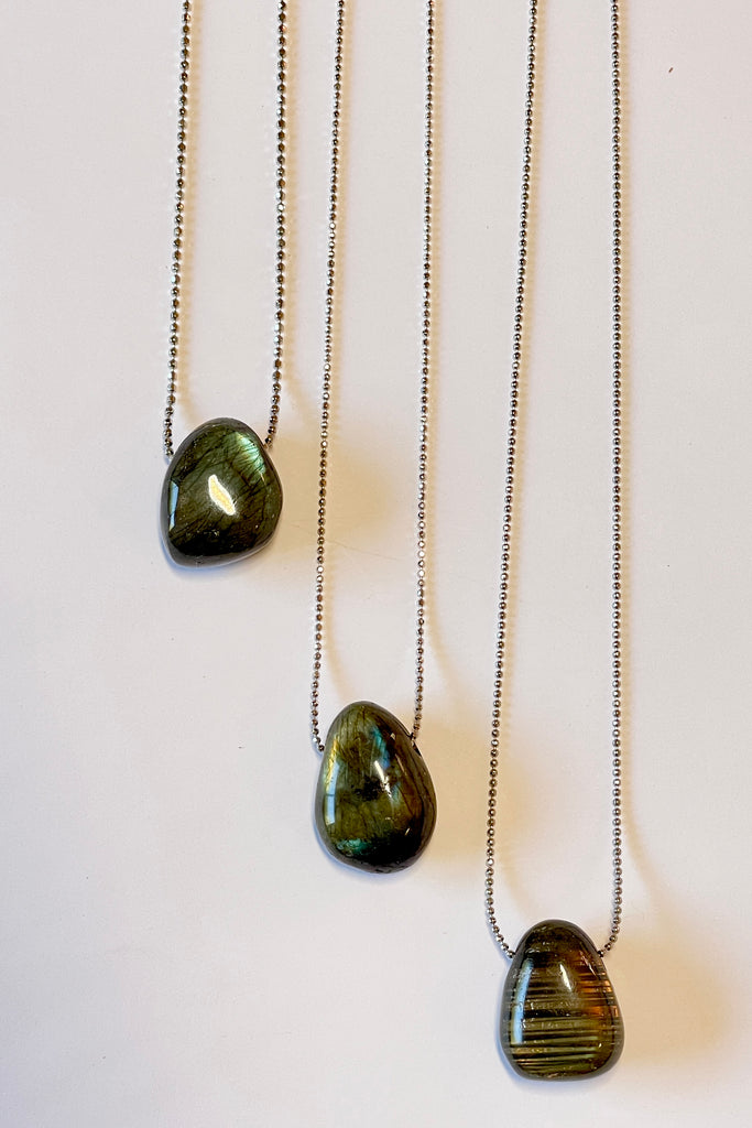 The Pendant Pebble Pop Labradorite is a smooth polished piece of the mystical gemstone Labradorite, it is a natural semi precious stone. Labradorite is considered a tremendously spiritual stone,