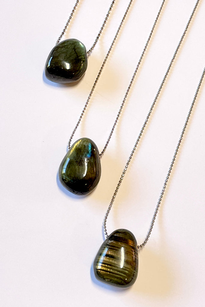The Pendant Pebble Pop Labradorite is a smooth polished piece of the mystical gemstone Labradorite, it is a natural semi precious stone. Labradorite is considered a tremendously spiritual stone,
