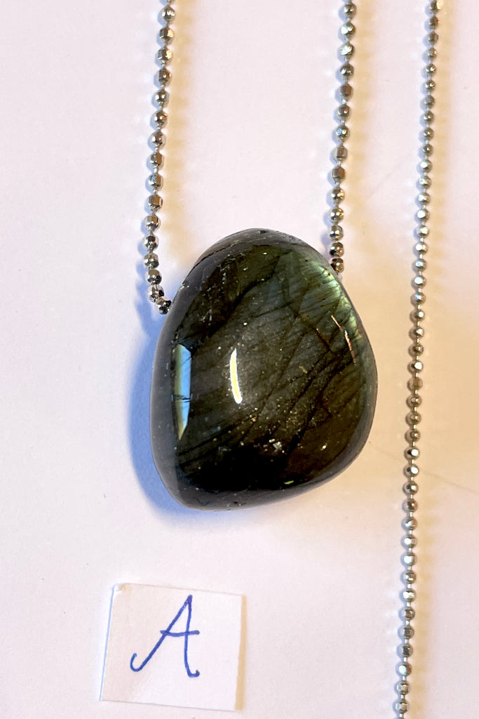 The Pendant Pebble Pop Labradorite is a smooth polished piece of the mystical gemstone Labradorite, it is a natural semi precious stone. Labradorite is considered a tremendously spiritual stone,