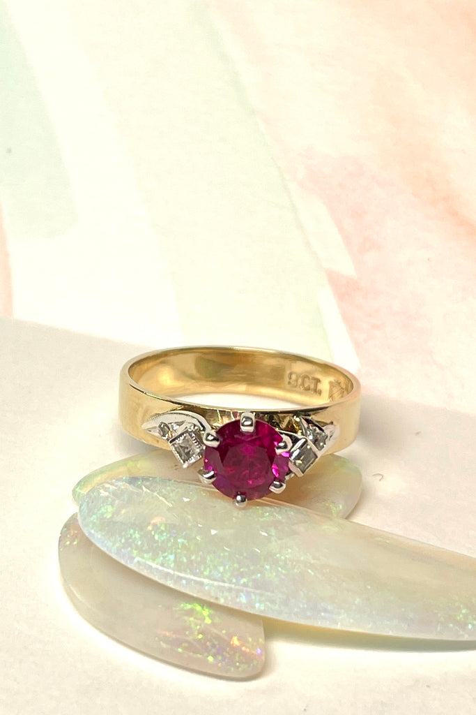 This stunning high set vintage ring features a bright Rhodolite Garnet gemstone. The band is wide and flat.  Pre worn with little signs of wear.