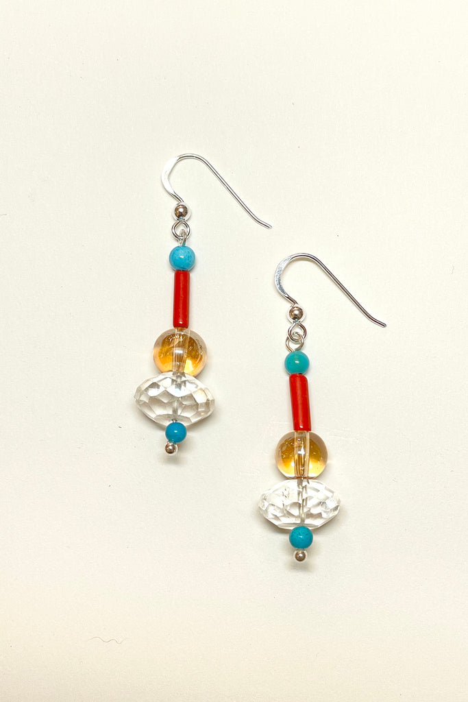 Inspired by cool aqua of the waves and sea these earrings are designed to sparkle like a turning wave in the coral sea. A drop design, with the sparkle of crystal. 