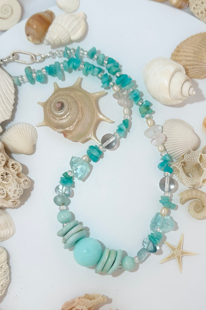 Stones are Blue Peruvian Opal, Amazonite, Rock Crystal, blue Quartz shards and Pearls. Many of these natural gemstones are "village" cut so are not regular, some carry inclusions or are irregular.