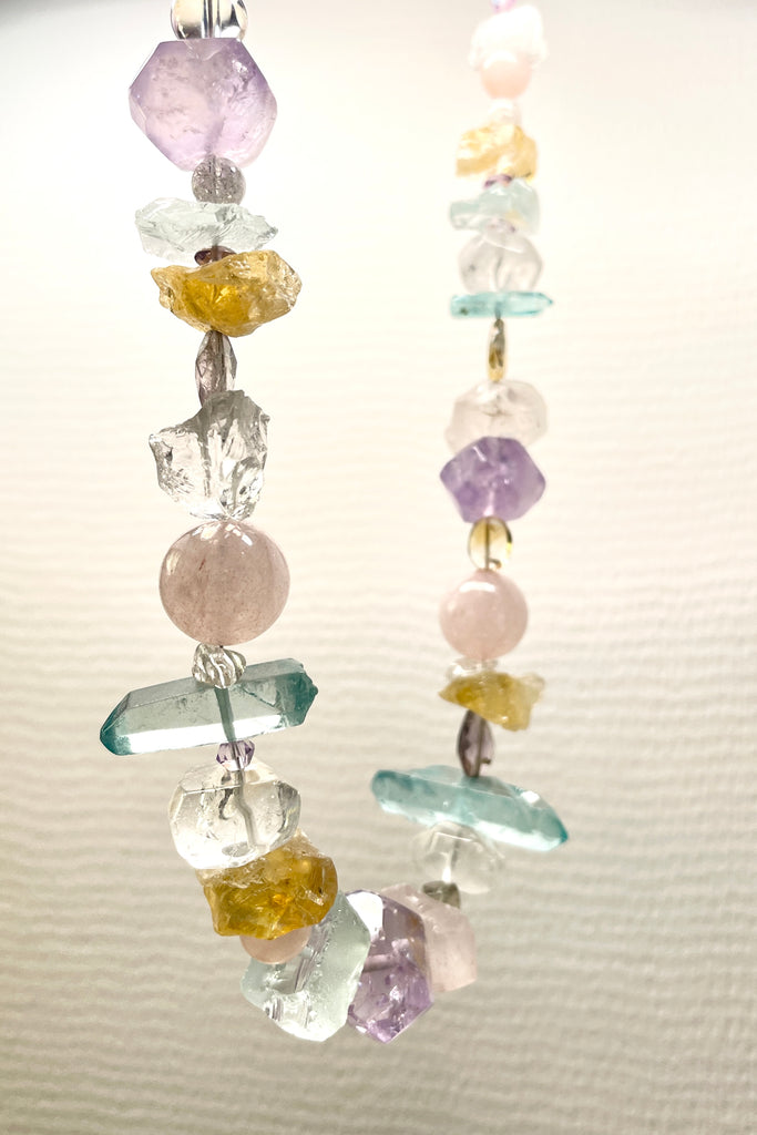 he Crystal Dream Necklace is designed and assembled using an assortment of new, old and repurposed material, each bead has a story to tell and together they are a powerful link to what was and what is to come. None of the stones are perfect, some are rough shards, some are village cut and some are highly polished. 