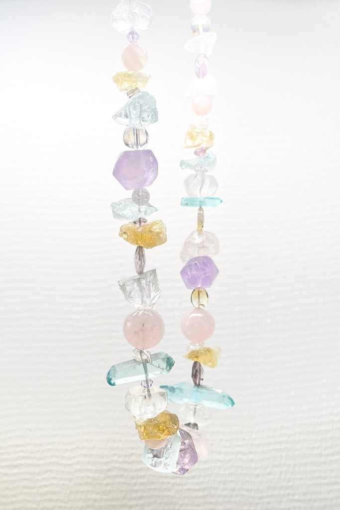 he Crystal Dream Necklace is designed and assembled using an assortment of new, old and repurposed material, each bead has a story to tell and together they are a powerful link to what was and what is to come. None of the stones are perfect, some are rough shards, some are village cut and some are highly polished. 