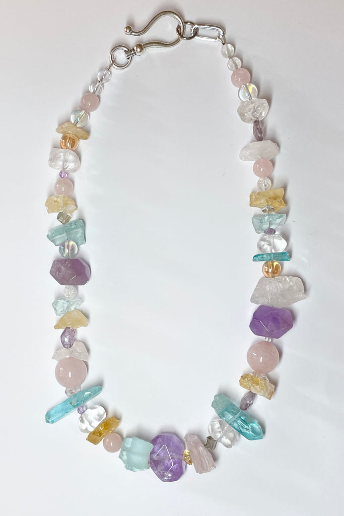 he Crystal Dream Necklace is designed and assembled using an assortment of new, old and repurposed material, each bead has a story to tell and together they are a powerful link to what was and what is to come. None of the stones are perfect, some are rough shards, some are village cut and some are highly polished. 