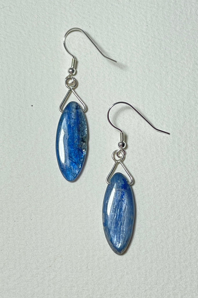 These Kyanite earrings feature a leaf shaped bead which is a hand cut and faceted from a shimmery cobalt blue Kyanite shard. Each pair is unique and handmade exclusively for us. 