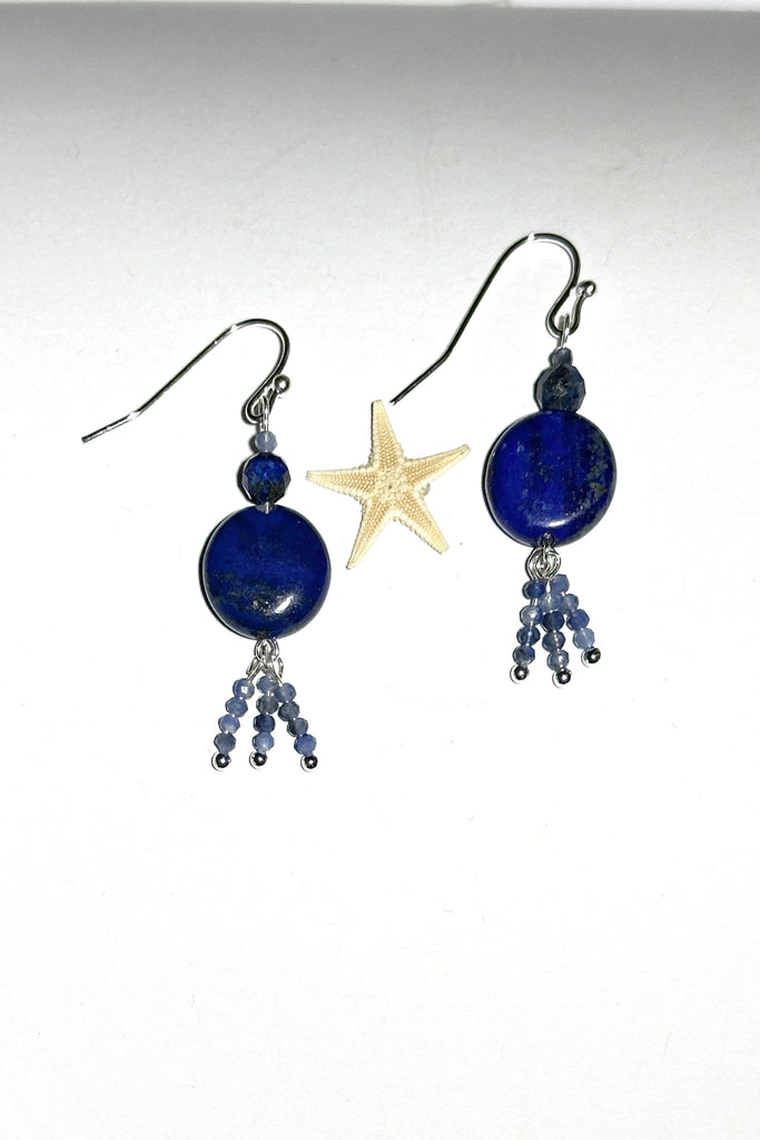 these earrings with dark blue Lapis Lazuli beads have three little tassels of paler blue Sodalite beads dancing below.&nbsp;