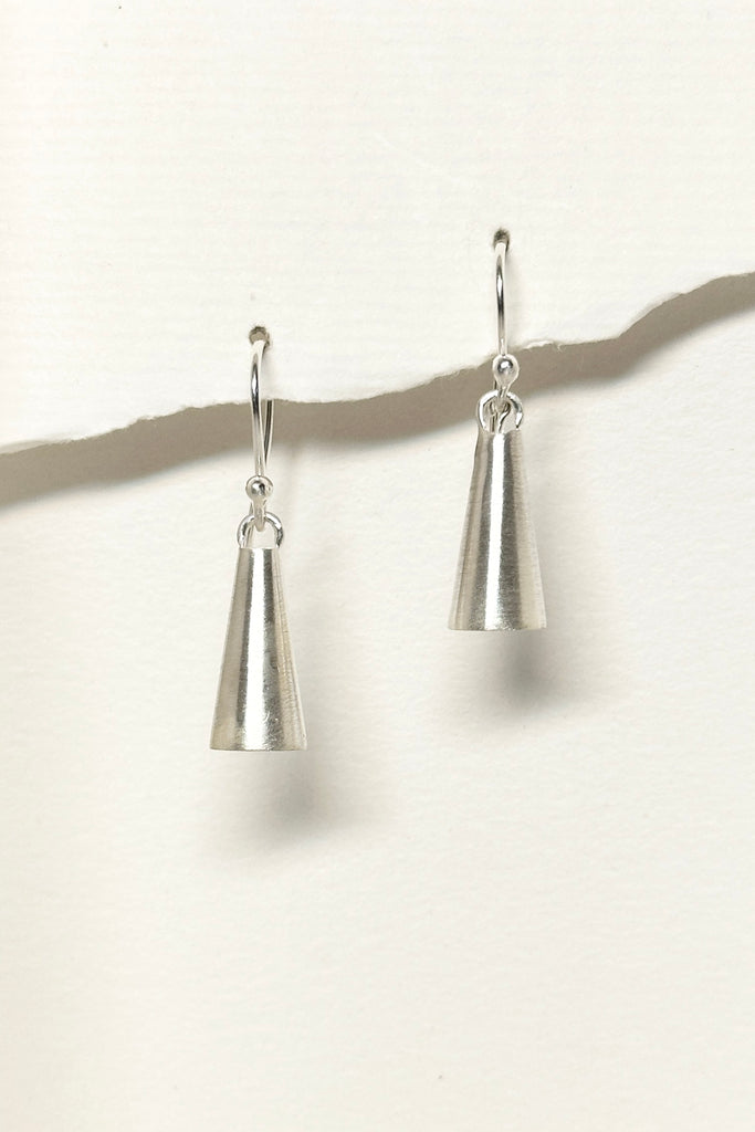 These tiny earrings are in a cone shape and look like a tiny bell. They have a lovely soft satin finish, and are light and comfortable to wear. Exclusive to Mombasa Rose Boutique.