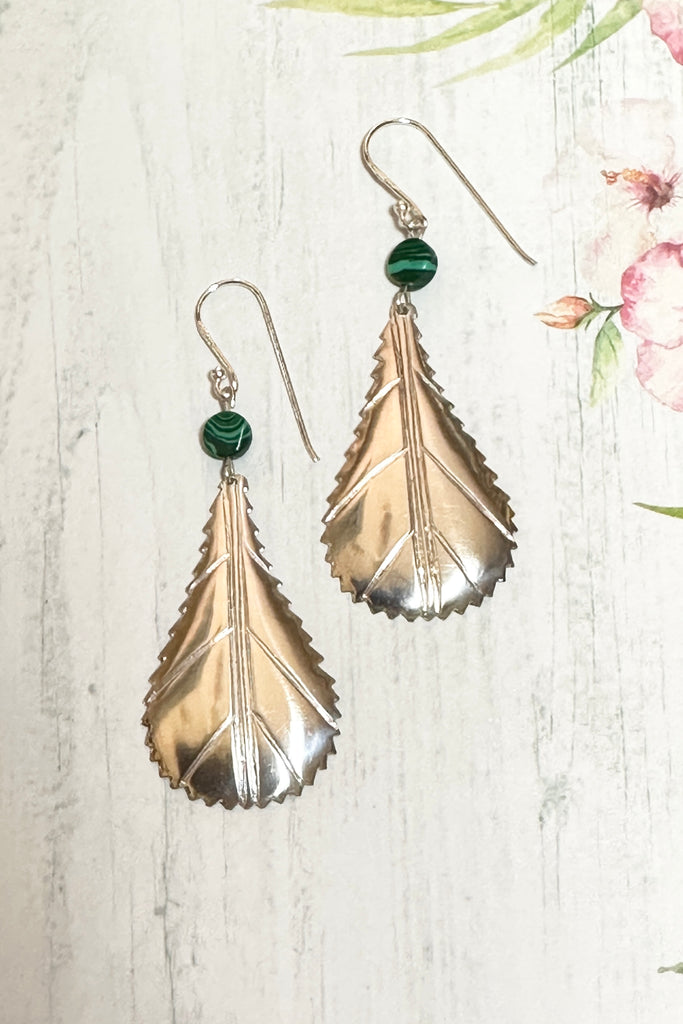 These African style leaf shaped earrings were designed in Mozambique, East Africa, exclusively for Mombasa Rose. In 925 silver, there is a small Malachite bead at the top.