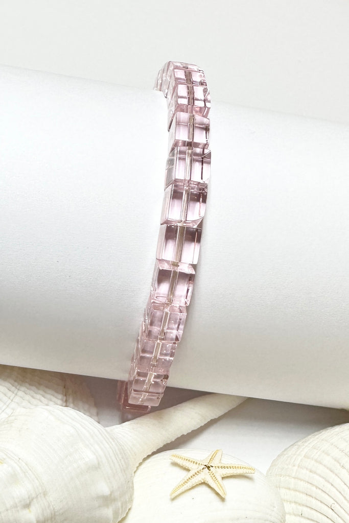 Perfectly easy and so pretty this bracelet of clear pale pink glass square bead on a stretch band