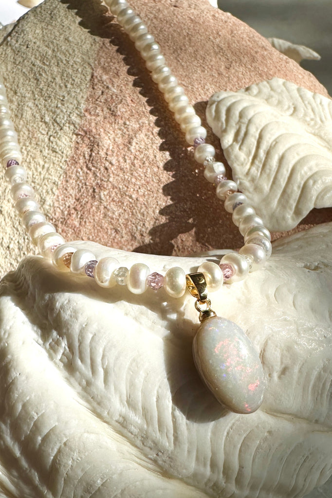Snowdrops and roses, this solid Australian Opal has soft subtle flashes deep pink, green and mauve, pearls interspaced with sparkling faceted gemstone beads, so cool and quiet.