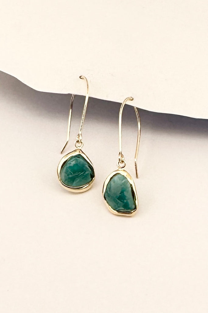 One off earrings made by bezel setting a shard of teal green natural Tourmaline, a very unique style, each side is slightly different. 