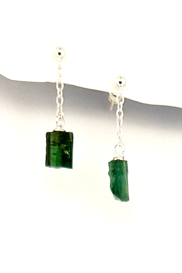 One off earrings made by hanging a natural crystal of green natural Tourmaline off a tiny chain, a very unique style, each side is slightly different.