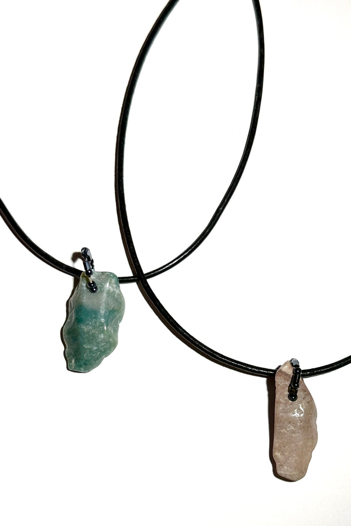 An interesting pendant made from an Agate stone that has been chipped into the shape of an ancient flint. 