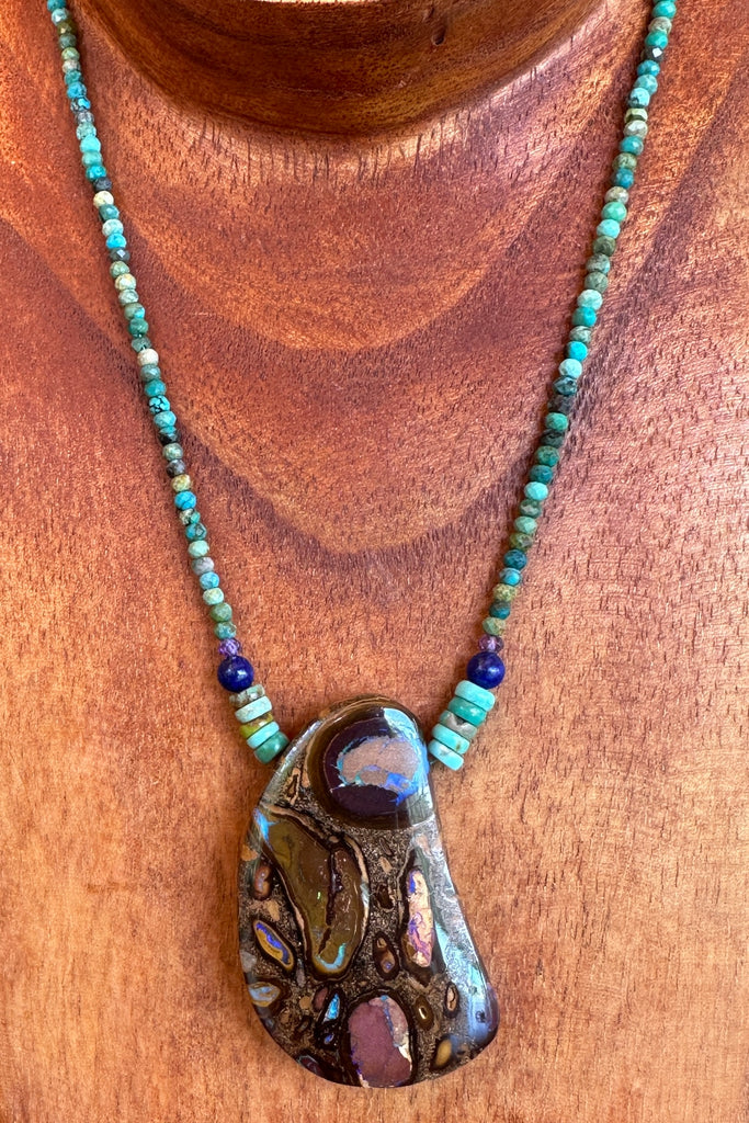 This necklace has been designed using a natural Australian Opal pendant strung on small faceted Natural rough Turquoise beads enhanced with Amethyst and Lapis Lazuli beads.