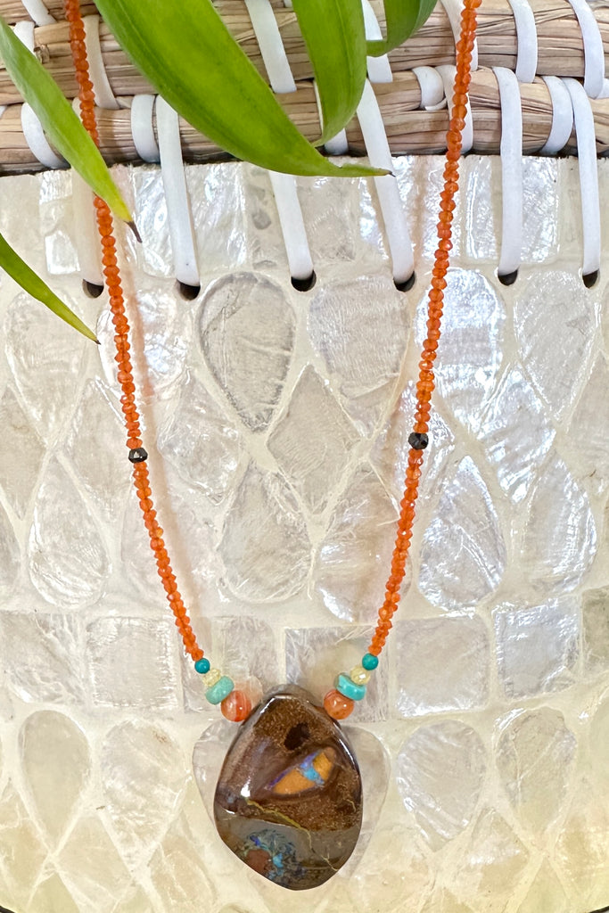This necklace has been designed using a natural Australian Opal pendant strung on small faceted Carnelian beads, and enhanced with natural Turquoise beads. The stones are all natural semi precious gems, there is a gorgeous harmony achieved that is reminiscent of the colours in the rocks and the water of Australia. T