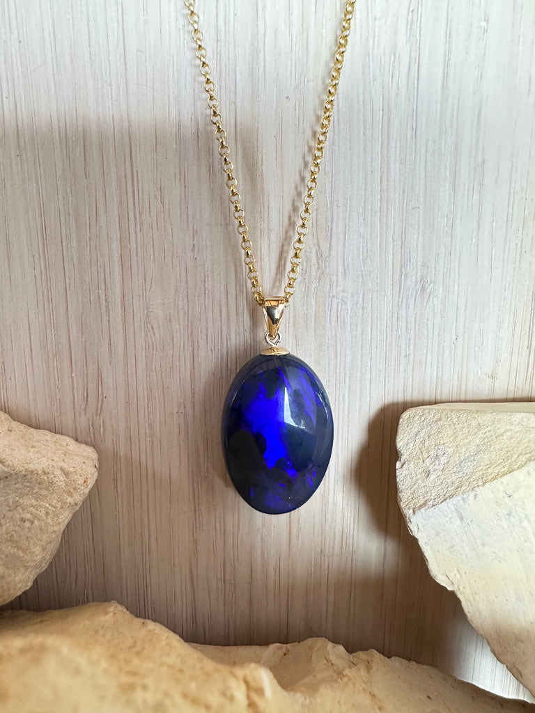 This opal pendant is an absolute stunner, a rolling flash of bright cobalt blue with tones of deep purple, the mystery of ancient water set in a stone from deep in the earth.
