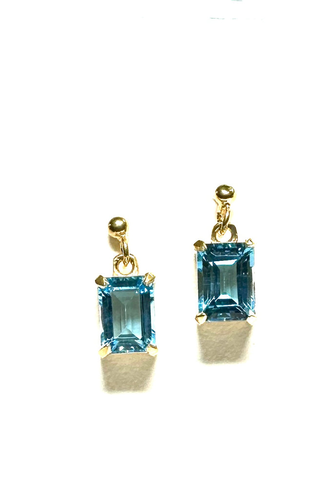 These pretty ocean coloured blue Topaz earrings are a perfect droplet of sea and sky. Pretty earrings with an emerald cut Blue Topaz gemstone set in 9ct gold vermeil. Made exclusively for Mombasa Rose Boutique.