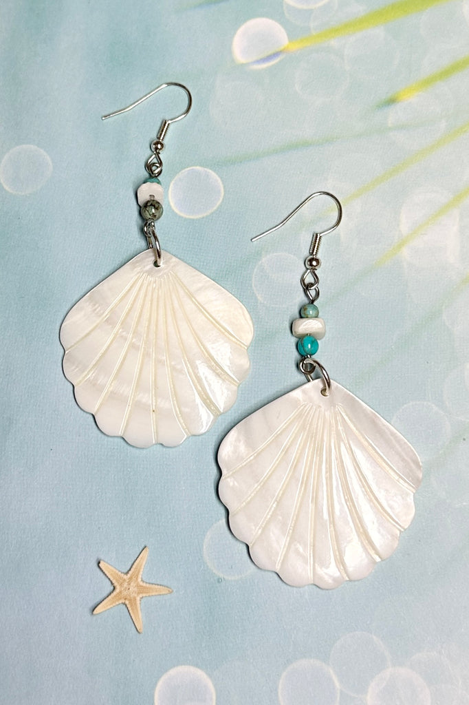 Inspired by a walk on the beach and sea tides, They are designed to make you happy. A drop design, with the blue of the water and hand cut mother of pearl shell