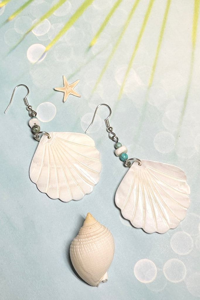 Inspired by a walk on the beach and sea tides, They are designed to make you happy. A drop design, with the blue of the water and hand cut mother of pearl shell