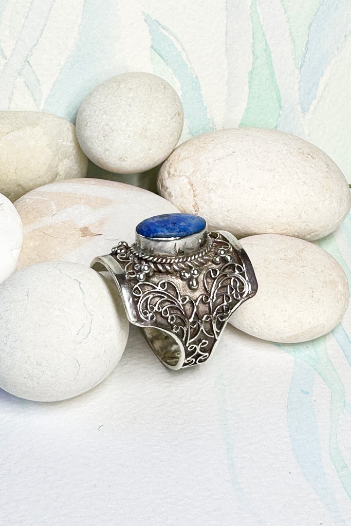 An unusual ring with a pretty cobalt blue Lapis Lazuli stone set in the centre, surrounding the stone is delicate silver filigree. The inside of the band is very smooth so it is comfortable to wear.