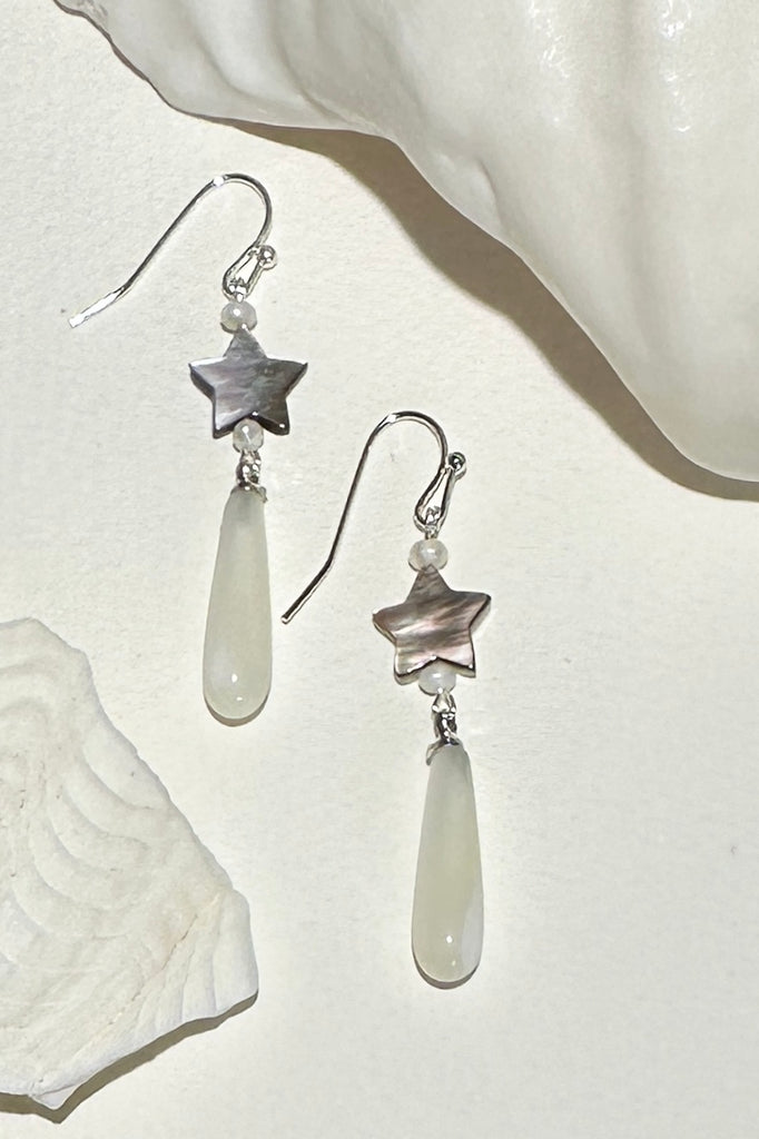 These pretty earrings are island chic perfection, so very cool, a shimmery Mother of Pearl droplet swings from a tiny silvery grey shell star.

Mother of Pearl droplet and hand cut star.
Small pearl accent beads.