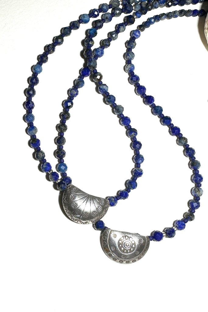 Necklace Lapis Fleur is a cascade of natural Lapis Lazuli beads, a pretty silver centre with floral decoration, just right to elevate a plain white top.


Natural Lapis Lazuli beads.
Thai silver centrepiece with applied floral motifs.