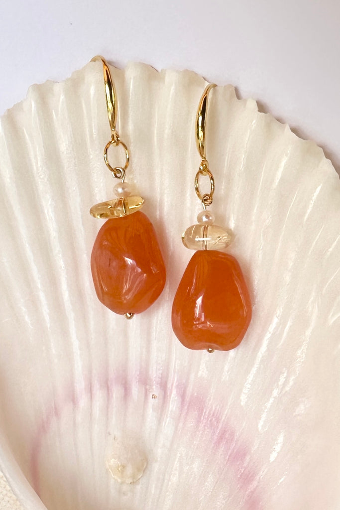 The Histoire earrings are designed using an assortment of new, old and repurposed stones, each stone has a story to tell and together they are a powerful link to what was, and to what is to come.&nbsp;

Softly rounded Carnelian bead.
Citrine nugget bead and a tiny pearl.
Drop style earrings statement earrings.