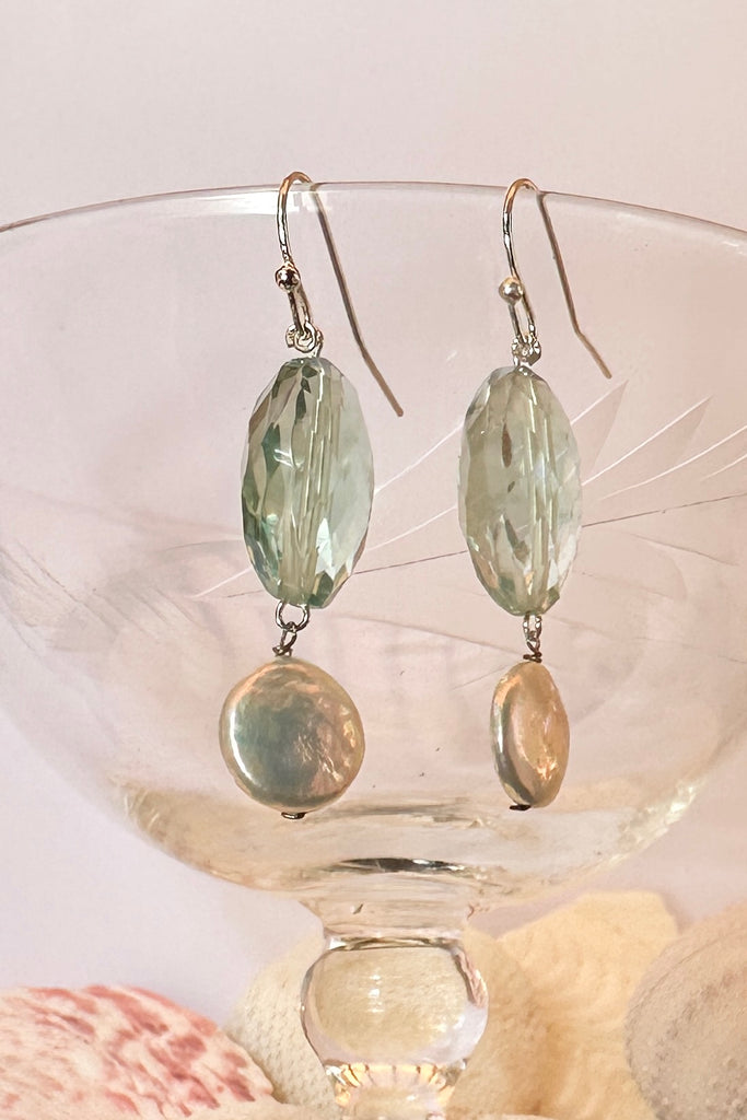 The Histoire earrings are designed using an assortment of new, old and repurposed stones, each stone has a story to tell and together they are a powerful link to what was, and to what is to come.&nbsp;

Green Fluorite faceted bead.
Freshwater coin pearl.
Drop style earrings statement earrings.