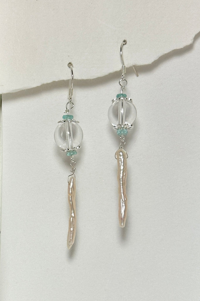 delicate pearl and crystal earrings Are as light as a shaft of sunlight through the ocean wave. A drop design, with the sparkle of crystal.