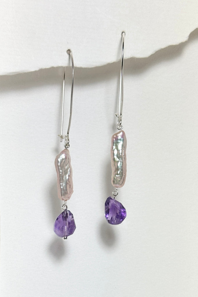 these delicate pearl and Amethyst earrings are designed to get you compliments!  A drop design, with the sparkle and style of Amethyst and the lustre of a pearl. 