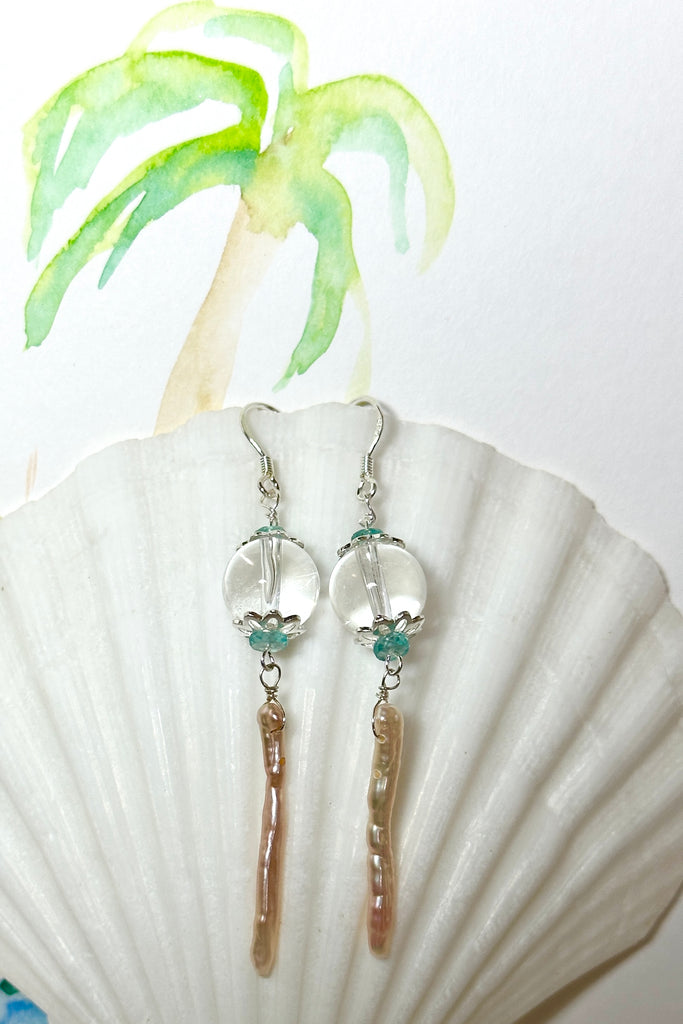 delicate pearl and crystal earrings Are as light as a shaft of sunlight through the ocean wave. A drop design, with the sparkle of crystal.