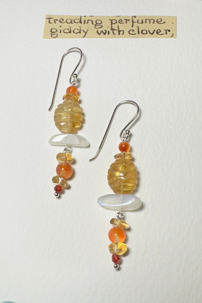 Drop style earrings statement earrings. Stones are a carved Citrine bead, natural Carnelian and Moonstone. Every stone earring will have different colour shading and intensity. Some are lighter and some have slight streaks. 