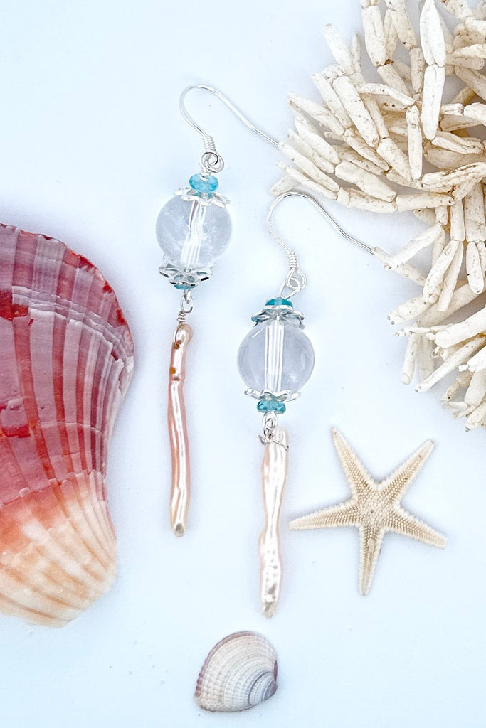 delicate pearl and crystal earrings Are as light as a shaft of sunlight through the ocean wave. A drop design, with the sparkle of crystal.