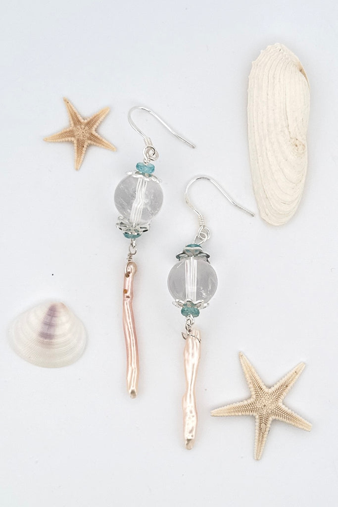 delicate pearl and crystal earrings Are as light as a shaft of sunlight through the ocean wave. A drop design, with the sparkle of crystal.