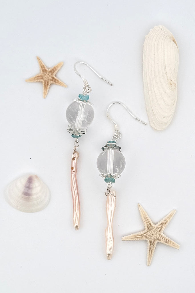 delicate pearl and crystal earrings Are as light as a shaft of sunlight through the ocean wave. A drop design, with the sparkle of crystal.
