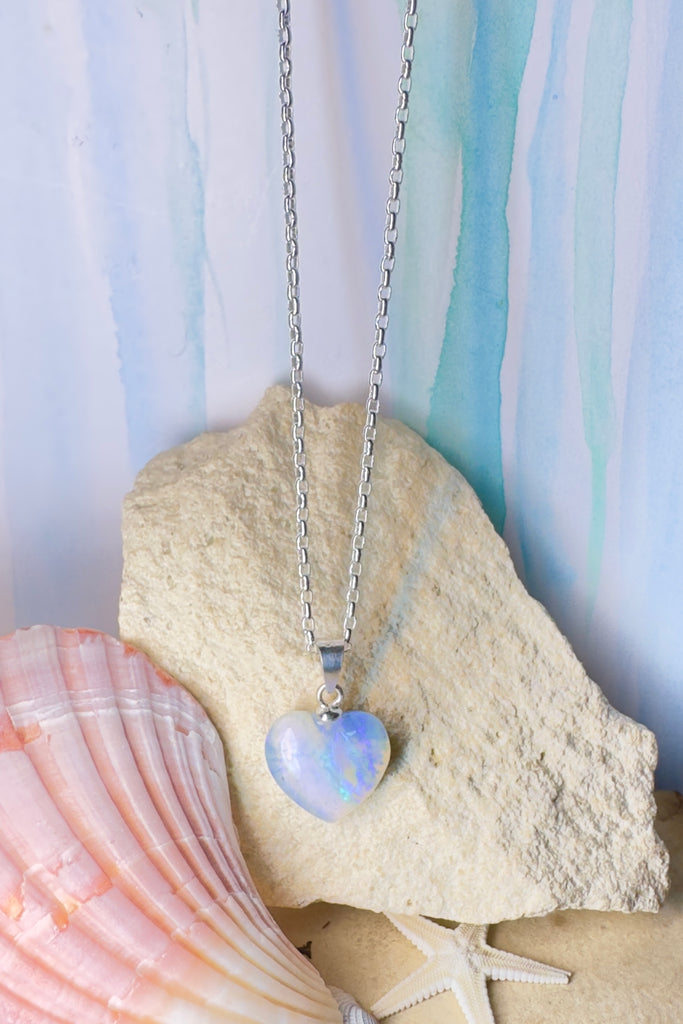 From our range of Australian opal pendants, this is tiny perfection, this opal heart pendant is like a tiny droplet of frozen water.