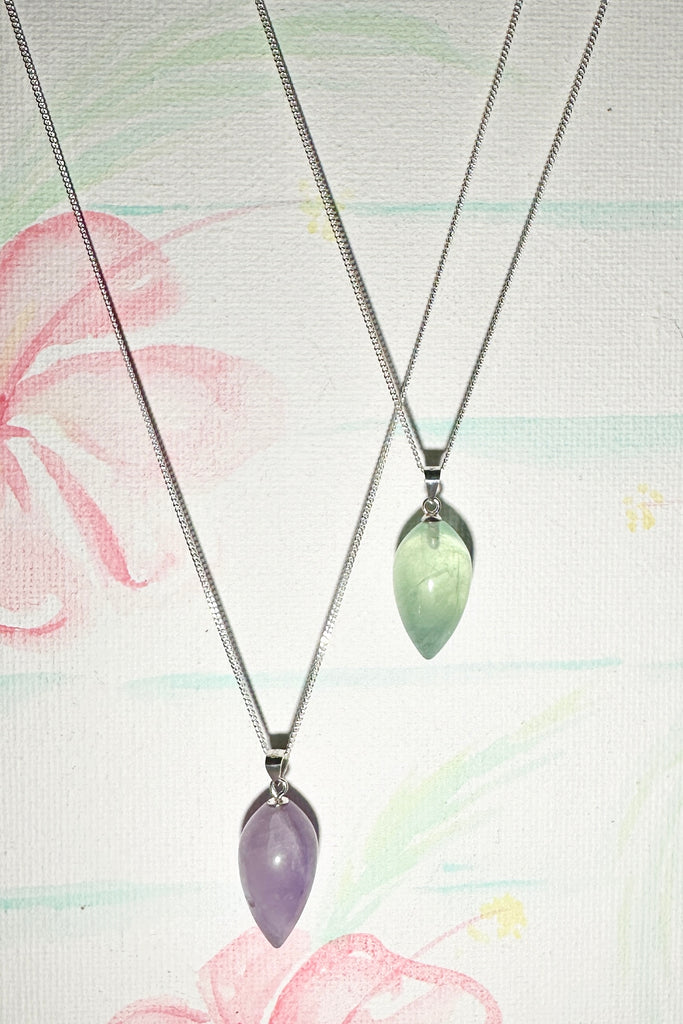 A Fluorite gemstone that has been hand formed into a sweet rounded droplet shape, it has a magical prettiness all of its own.&nbsp;

Fluorite gemstone hand carved into a rounded drople